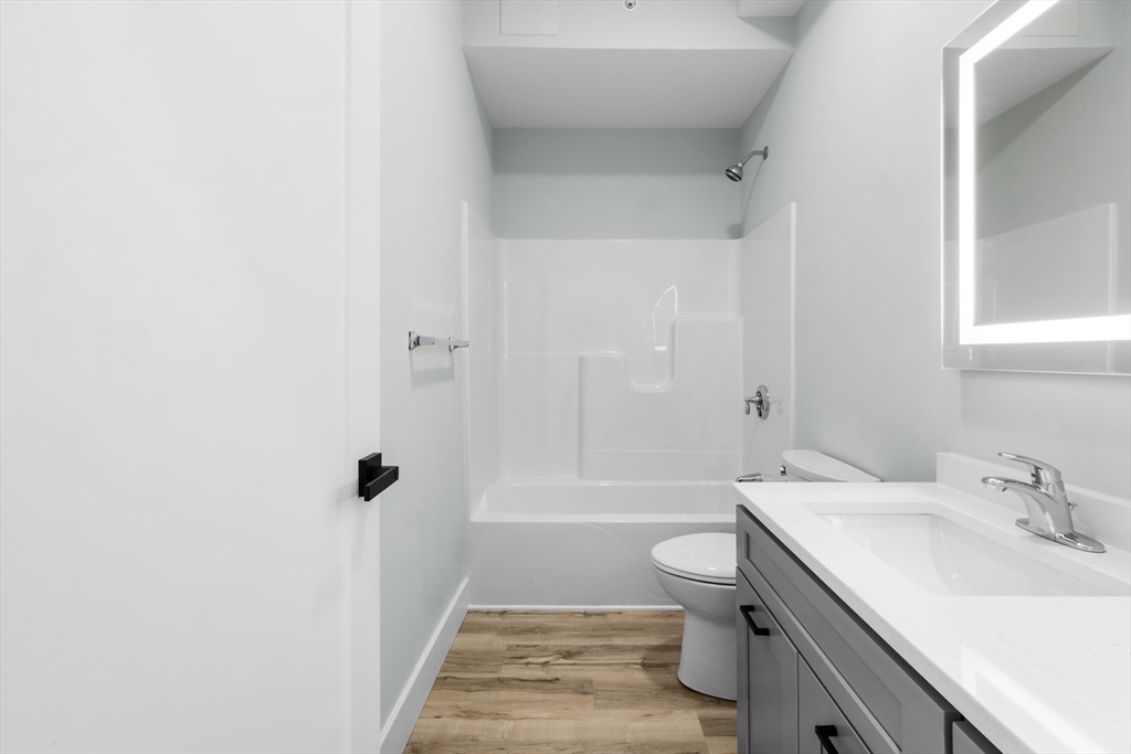 889-895 Grinnell Street, Unit 2 Fall River, MA 02721 - Photo 24 of 42 a bathroom with a sink a toilet and shower