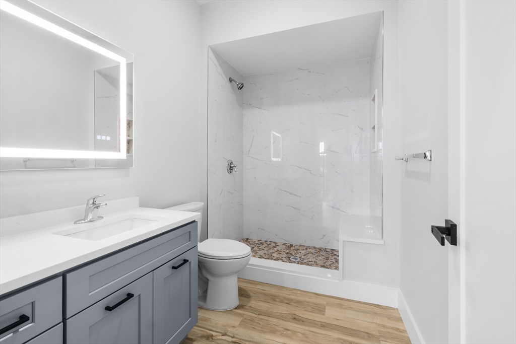 889-895 Grinnell Street, Unit 2 Fall River, MA 02721 - Photo 29 of 42 a bathroom with a sink a toilet and shower