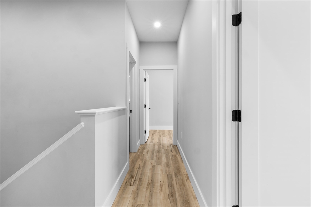 889-895 Grinnell Street, Unit 2 Fall River, MA 02721 - Photo 30 of 42 a view of a hallway with wooden floor and staircase