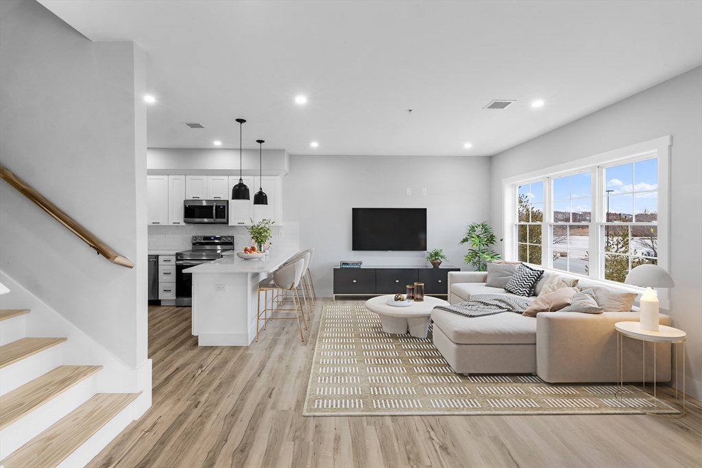 889-895 Grinnell Street, Unit 2 Fall River, MA 02721 - Photo 4 of 42 a living room with furniture and a flat screen tv