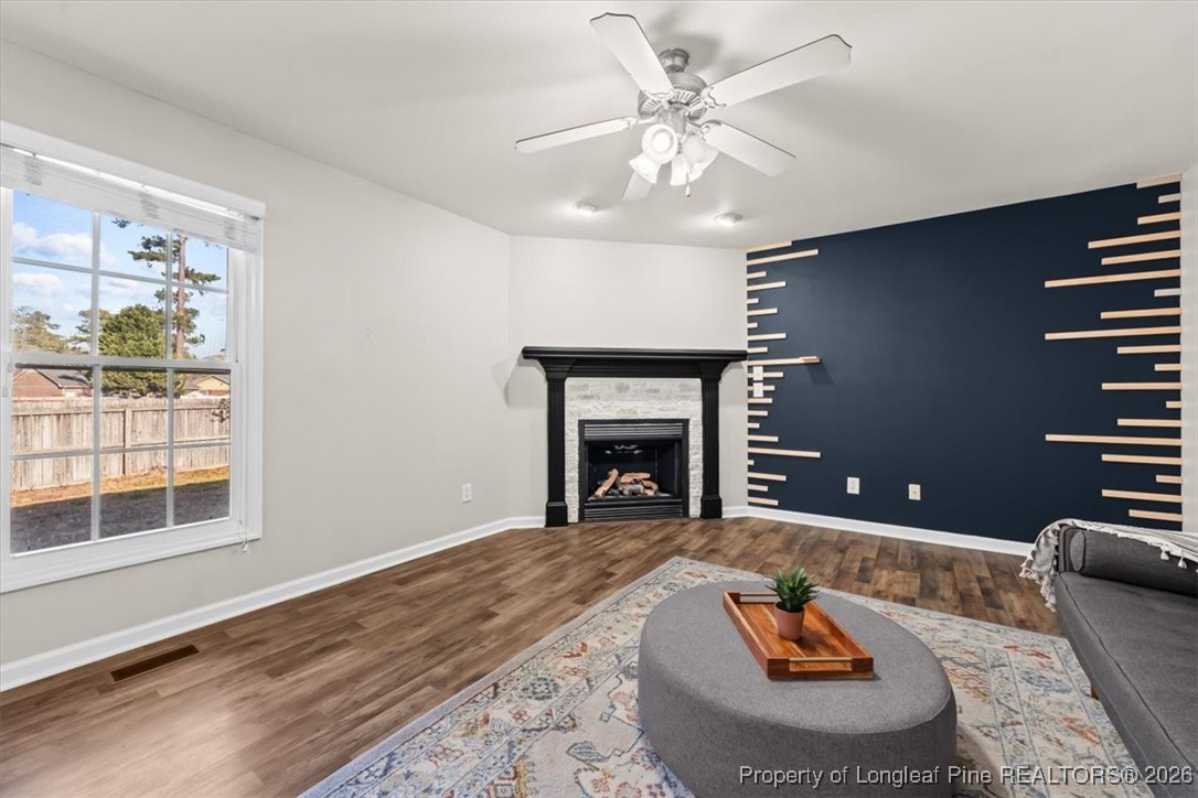 2736 Millmann Road Fayetteville, NC 28304 - Photo 13 of 33 a living room with furniture and a fireplace
