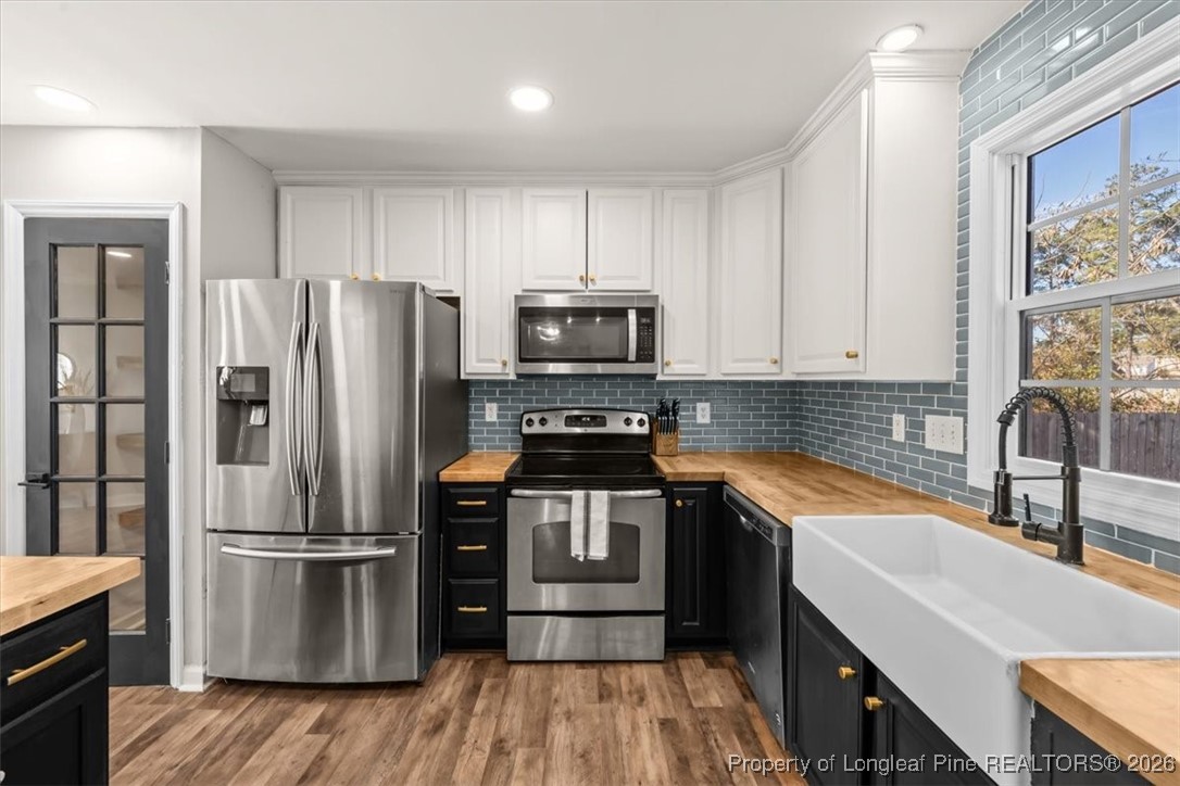 2736 Millmann Road Fayetteville, NC 28304 - Photo 15 of 33 a kitchen with a refrigerator stove and sink