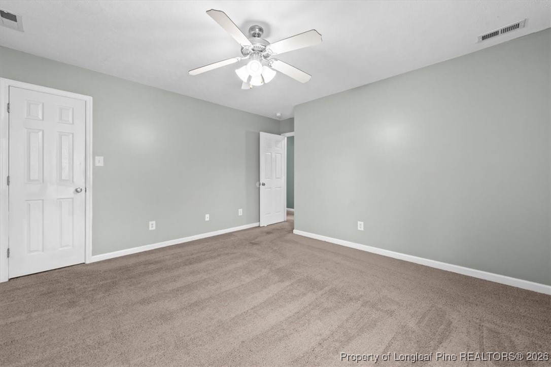 2736 Millmann Road Fayetteville, NC 28304 - Photo 33 of 33 a view of an empty room with a chandelier fan