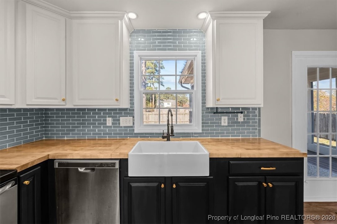 2736 Millmann Road Fayetteville, NC 28304 - Photo 9 of 33 a kitchen with a sink cabinets and window