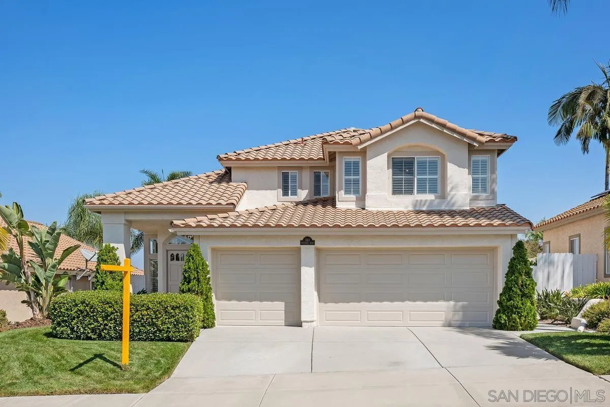 a front view of a house with garage