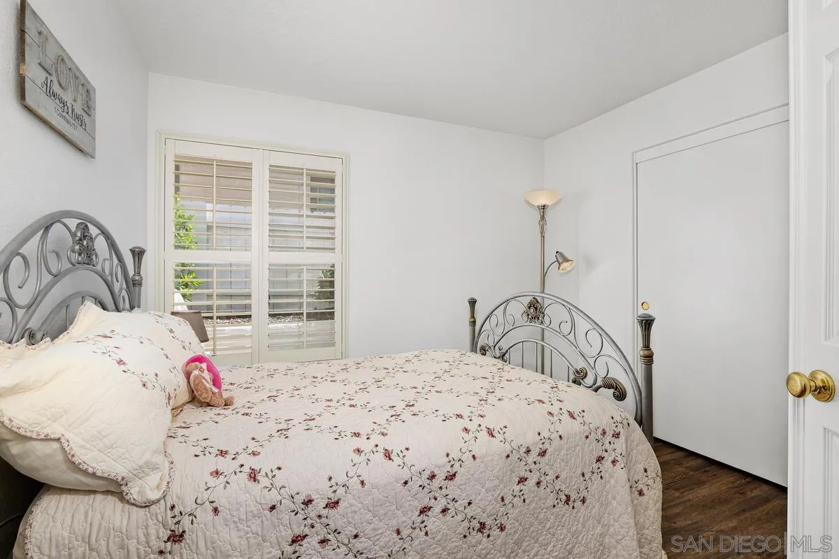 649 Montage Road Oceanside, CA 92057 - Photo 11 of 26 a bedroom with a bed and a window