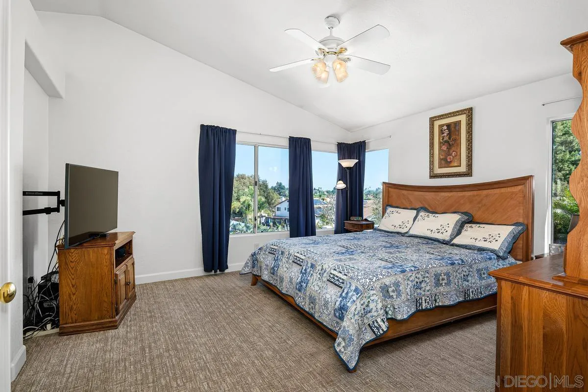 649 Montage Road Oceanside, CA 92057 - Photo 13 of 26 a bedroom with a bed and dresser with mirror