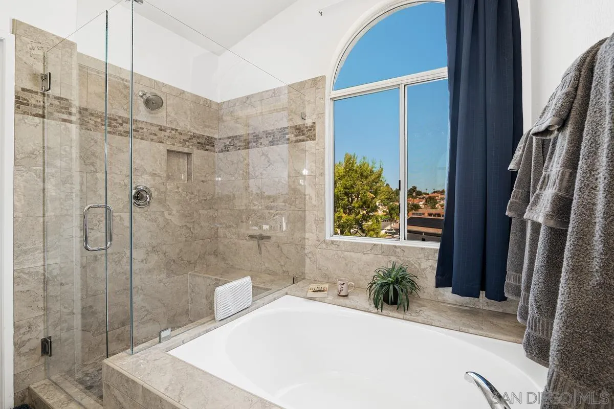 649 Montage Road Oceanside, CA 92057 - Photo 16 of 26 a bathroom with a bathtub and shower