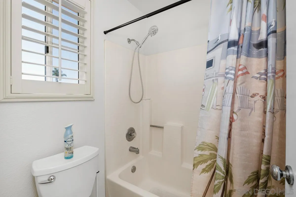 649 Montage Road Oceanside, CA 92057 - Photo 22 of 26 a bathroom with a sink a toilet and shower