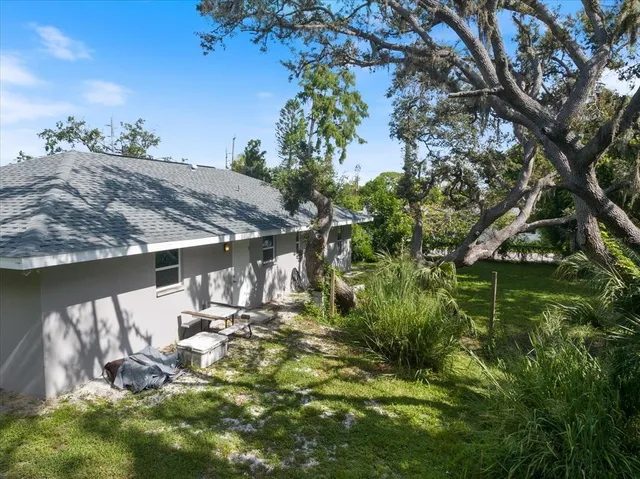 an aerial view of residential house with outdoor space