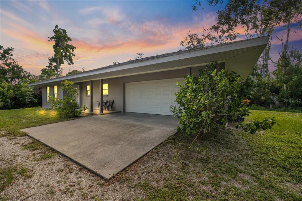 8915 Vamo Road Sarasota, FL 34231 - Photo 3 of 61 front view of a house with a yard