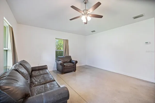 a bedroom with a bed and a table in it