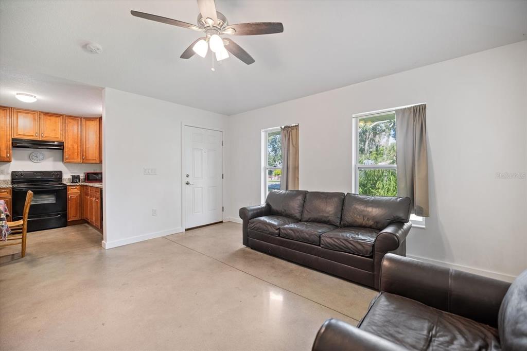8915 Vamo Road Sarasota, FL 34231 - Photo 33 of 61 a living room with furniture and a window