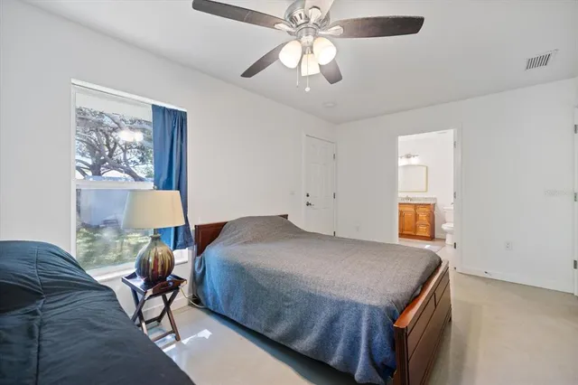 a view of a livingroom with gym equipment and a window