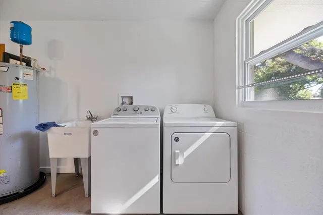 a view of an house with backyard space and tree