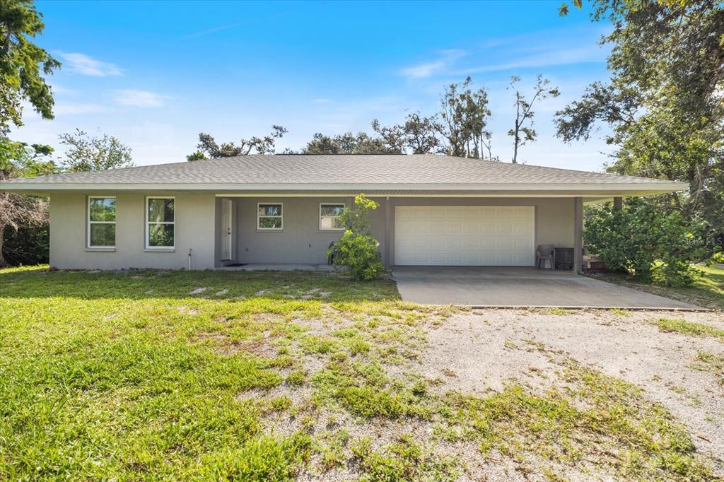 8915 Vamo Road Sarasota, FL 34231 - Photo 46 of 61 front view of a house with a yard
