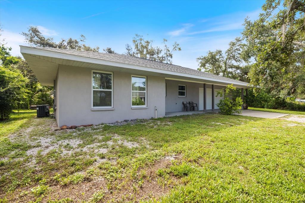 8915 Vamo Road Sarasota, FL 34231 - Photo 55 of 61 a view of a house with a yard