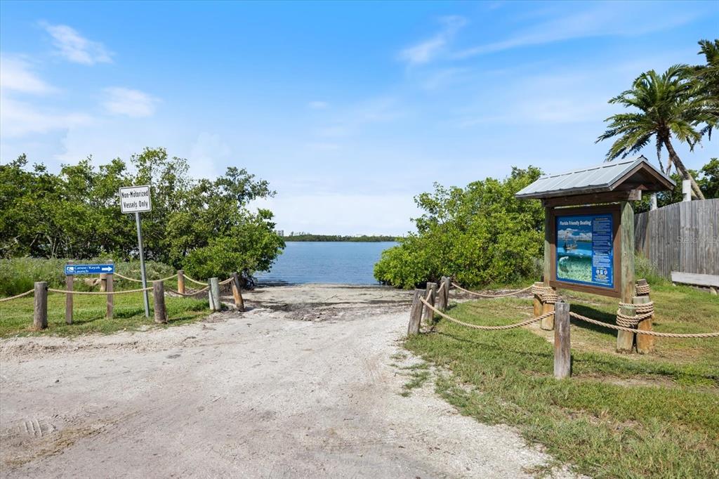 8915 Vamo Road Sarasota, FL 34231 - Photo 58 of 61 a row of palm trees in front of house