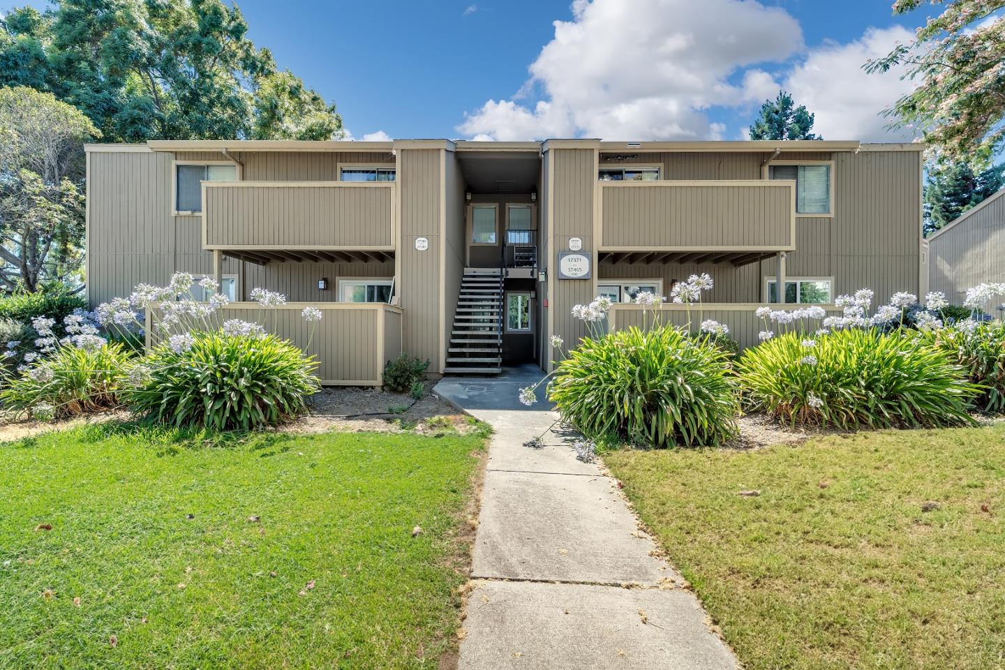 a front view of a house with garden