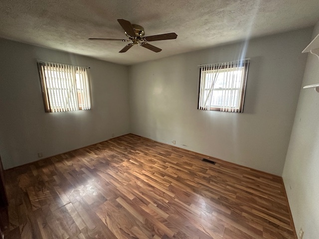 735 Geneva Avenue Romeoville, IL 60446 - Photo 13 of 25 a view of empty room with wooden floor and fan