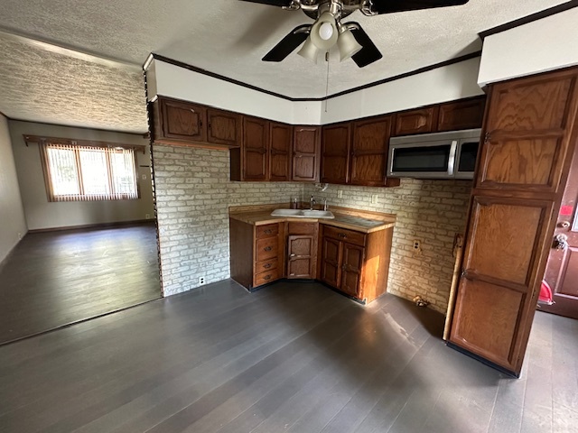 735 Geneva Avenue Romeoville, IL 60446 - Photo 5 of 25 a kitchen with stainless steel appliances granite countertop a stove and a sink
