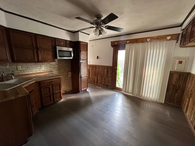 735 Geneva Avenue Romeoville, IL 60446 - Photo 6 of 25 a open kitchen with stainless steel appliances granite countertop a refrigerator oven a sink dishwasher and a stove with wooden floor