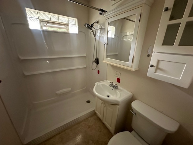 735 Geneva Avenue Romeoville, IL 60446 - Photo 9 of 25 a bathroom with a toilet sink and mirror