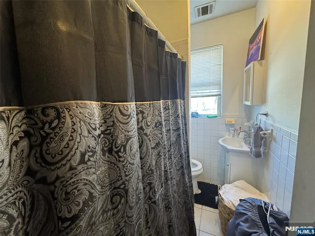 a bathroom with a bathtub and toilet