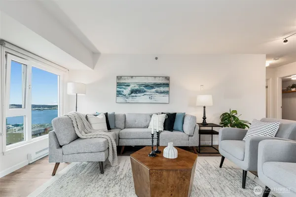 a living room with furniture and a large window