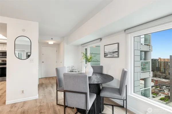 a view of a dining room with furniture and a window