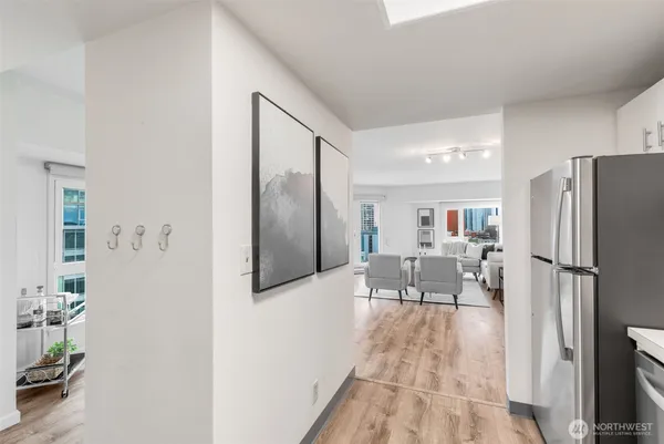 a kitchen with stainless steel appliances a refrigerator and a stove top oven