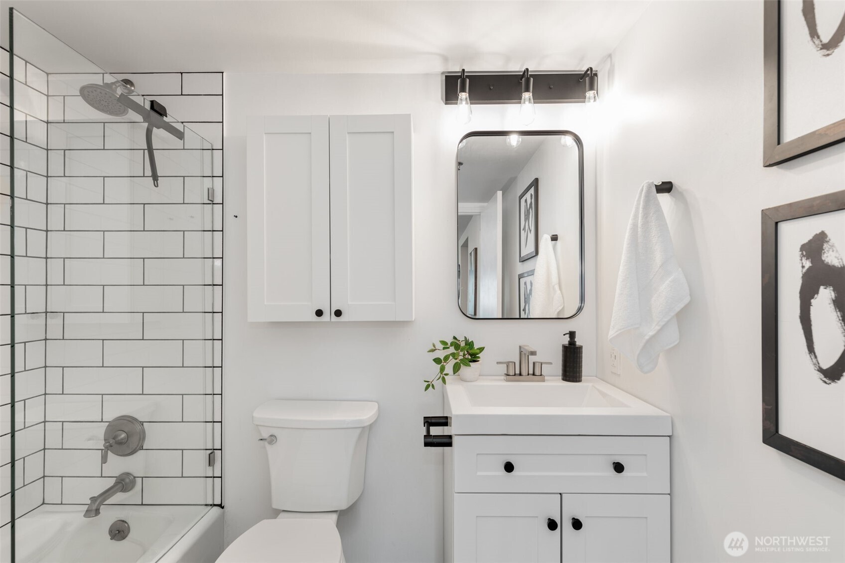 121 Vine Street, Unit 1507 Seattle, WA 98121 - Photo 16 of 40 a bathroom with a sink toilet and shower