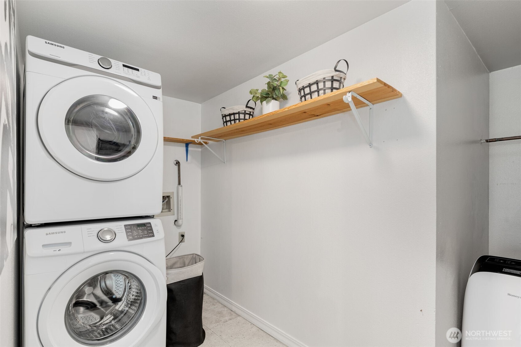 121 Vine Street, Unit 1507 Seattle, WA 98121 - Photo 17 of 40 a close up view of a washer and dryer