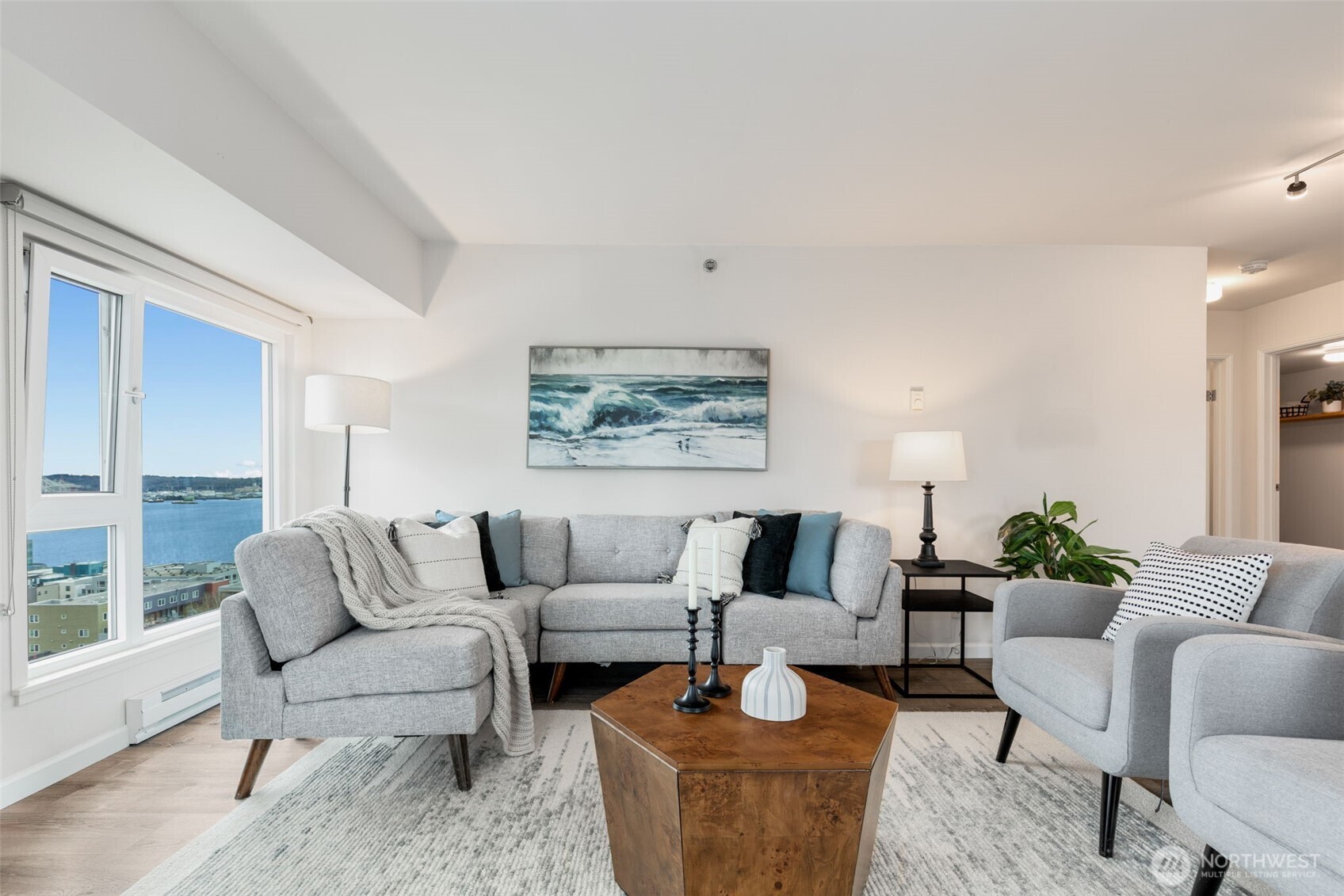 121 Vine Street, Unit 1507 Seattle, WA 98121 - Photo 2 of 40 a living room with furniture and a large window
