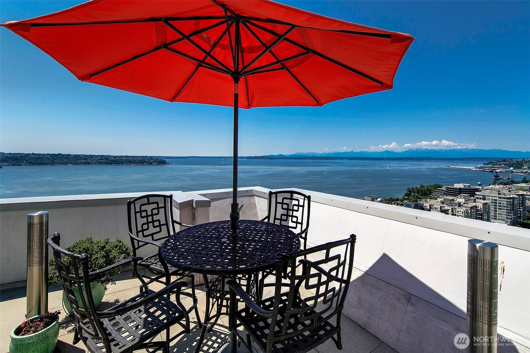 121 Vine Street, Unit 1507 Seattle, WA 98121 - Photo 23 of 40 a table that has a lawn chairs and a umbrella