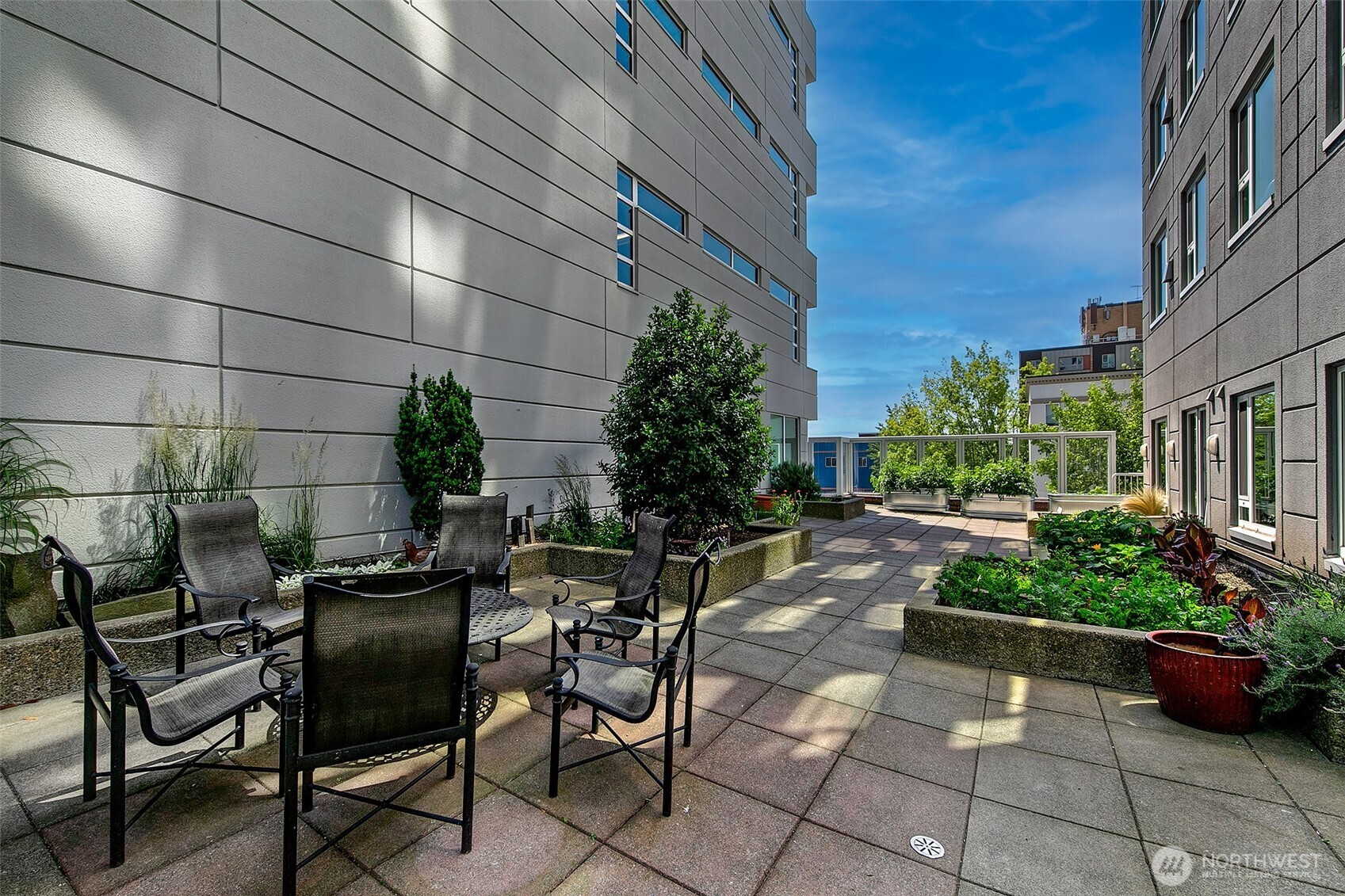121 Vine Street, Unit 1507 Seattle, WA 98121 - Photo 30 of 40 a view of yard with seating area and green space
