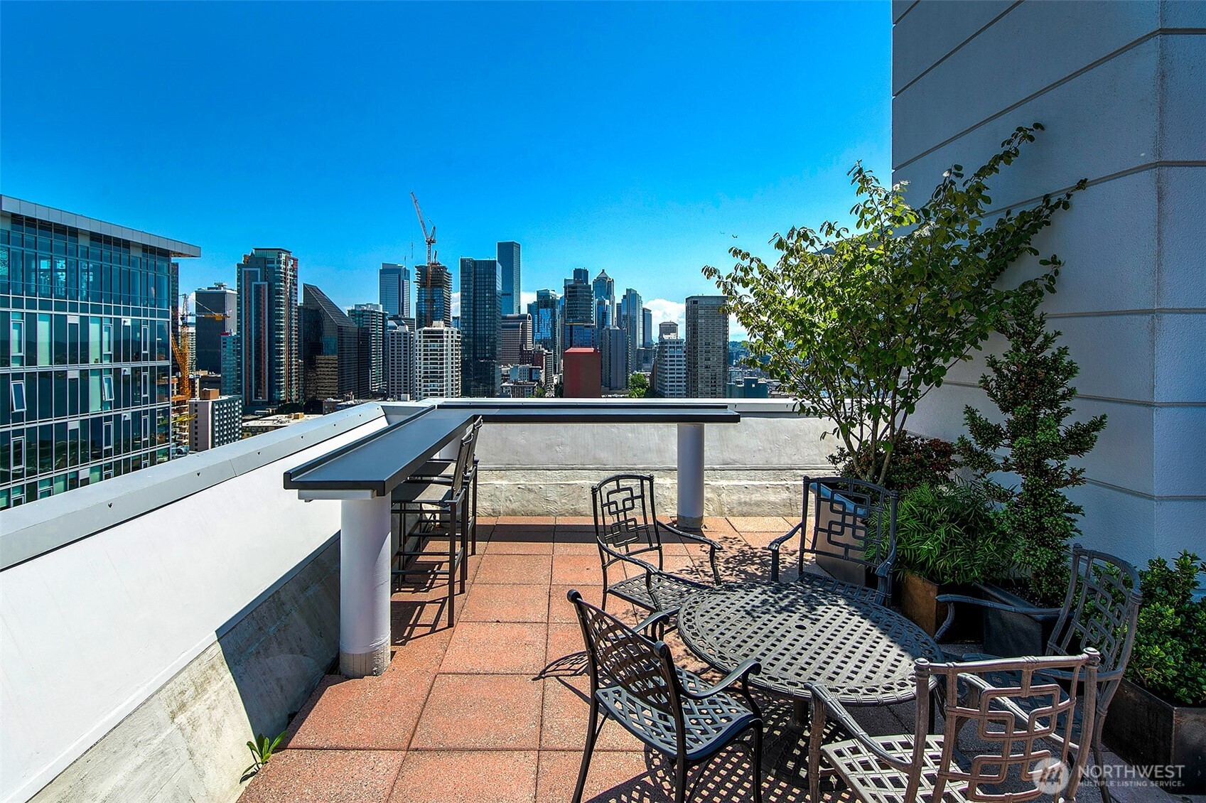121 Vine Street, Unit 1507 Seattle, WA 98121 - Photo 32 of 40 a view of a terrace with sitting area