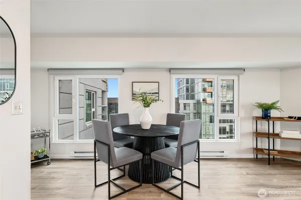 a view of a dining room with furniture and wooden floor