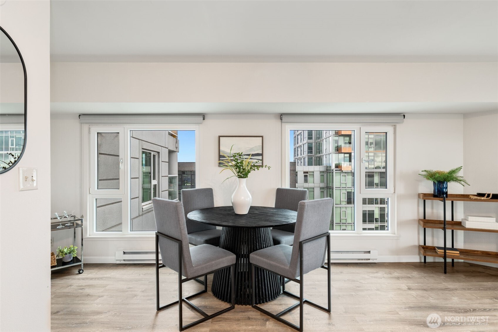 121 Vine Street, Unit 1507 Seattle, WA 98121 - Photo 7 of 40 a view of a dining room with furniture and wooden floor