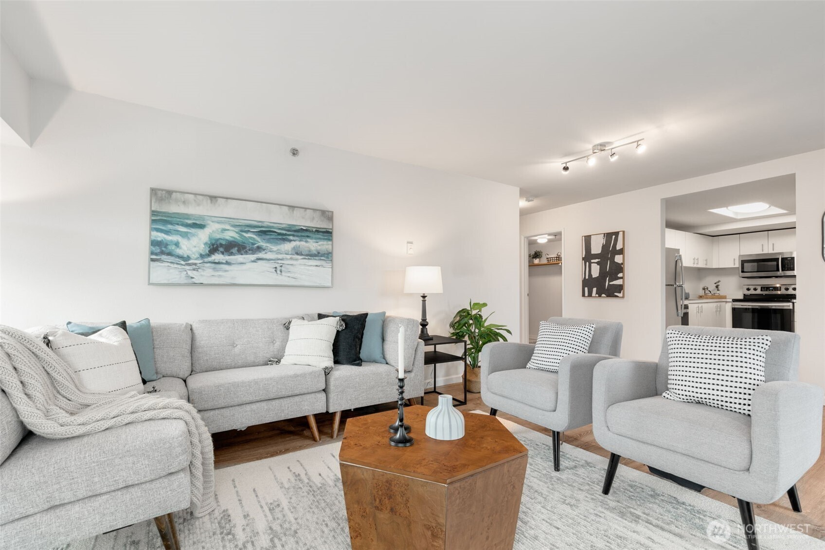 121 Vine Street, Unit 1507 Seattle, WA 98121 - Photo 10 of 40 a living room with furniture and a painting on the wall