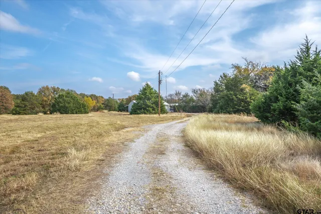 a view of lake with green space