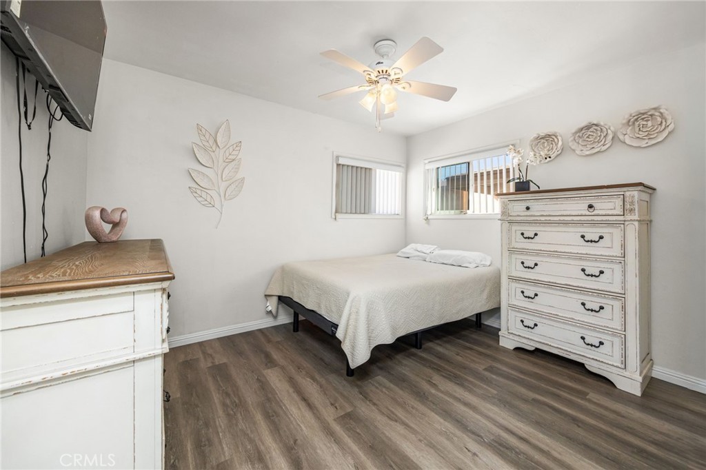 435 East Adams Street Santa Ana, CA 92707 - Photo 11 of 32 a bedroom with a bed and a chandelier