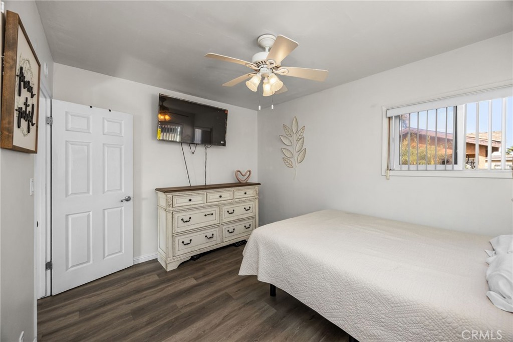 435 East Adams Street Santa Ana, CA 92707 - Photo 12 of 32 a bedroom with a bed a window and a flat screen tv