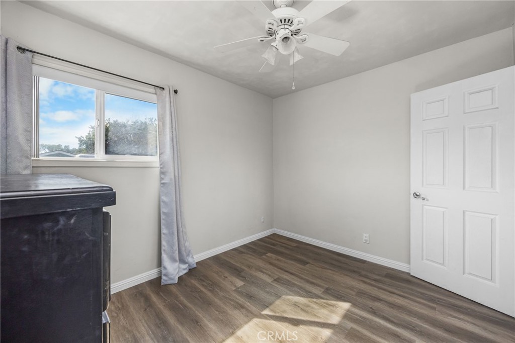 435 East Adams Street Santa Ana, CA 92707 - Photo 18 of 32 a view of a livingroom with wooden floor and a chandelier