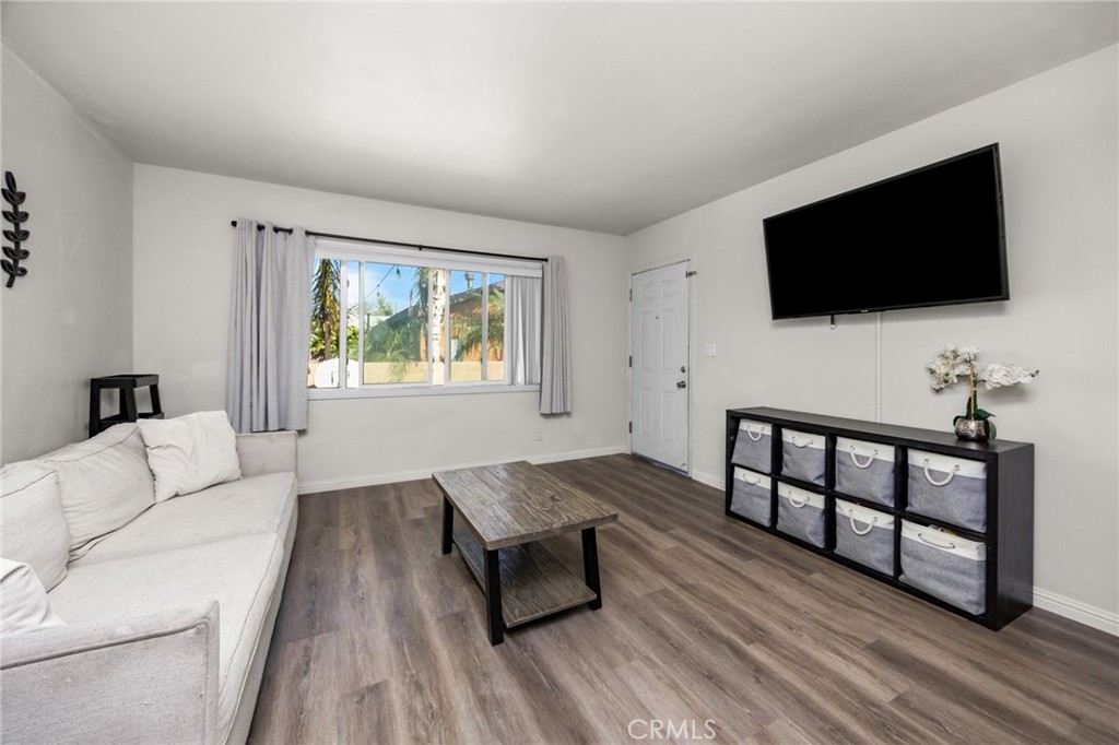 435 East Adams Street Santa Ana, CA 92707 - Photo 6 of 32 a living room with furniture and a flat screen tv