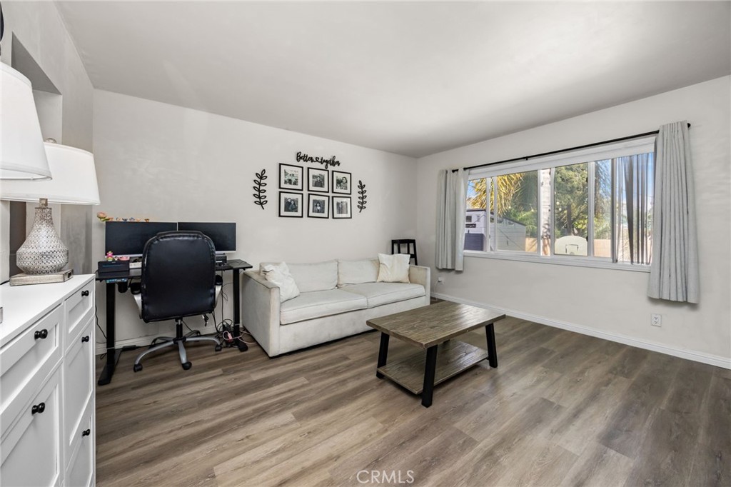 435 East Adams Street Santa Ana, CA 92707 - Photo 7 of 32 a living room with furniture and a window