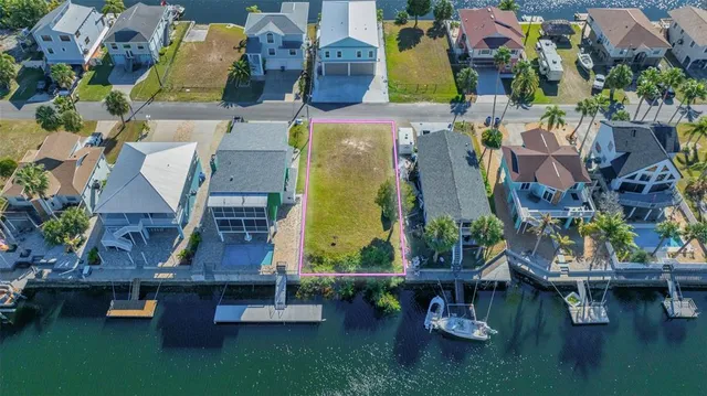 an aerial view of houses with outdoor space