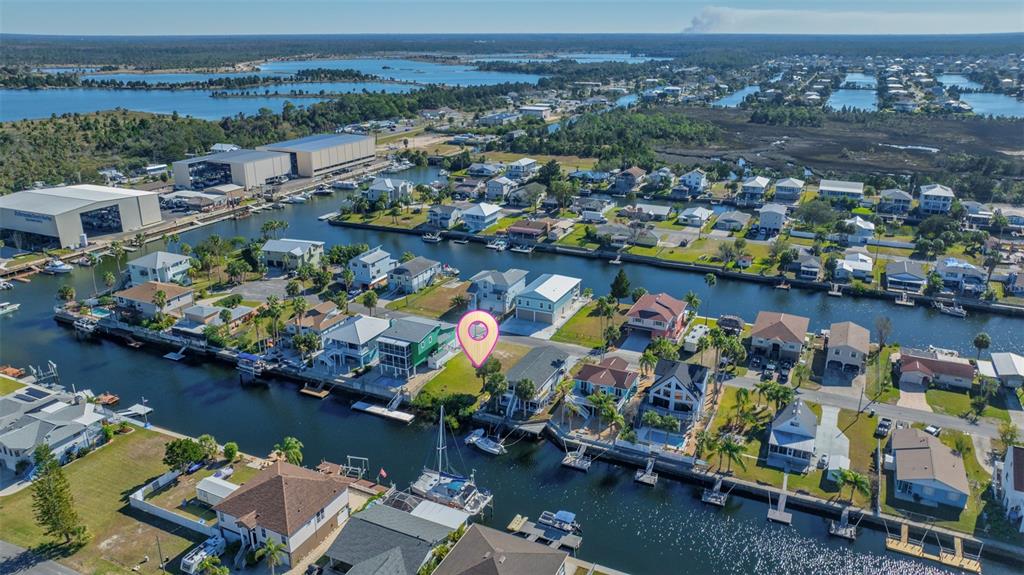 4029 Casa Court Hernando Beach, FL 34607 - Photo 6 of 10 an aerial view of a house with a swimming pool a patio and yard