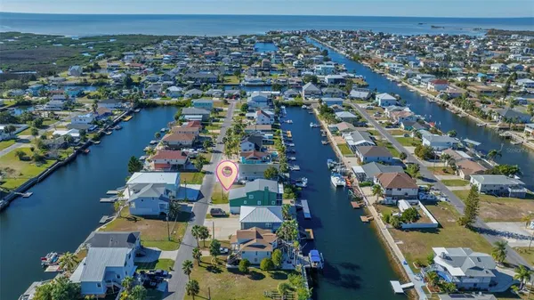 an aerial view of residential houses with outdoor space