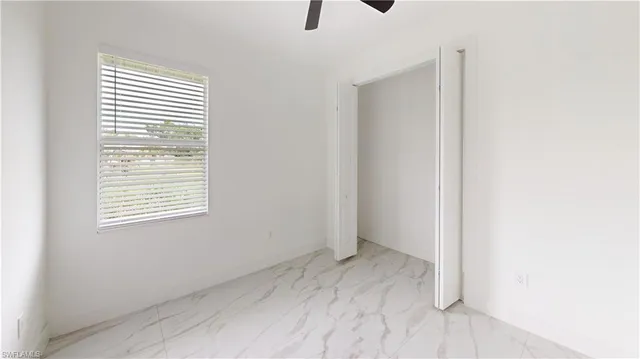 a kitchen with stainless steel appliances a refrigerator sink and microwave